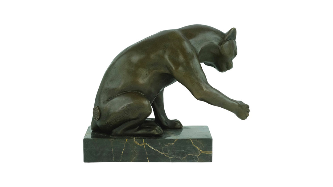 Bronze sculpture of a playing cat