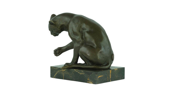 Bronze sculpture of a playing cat
