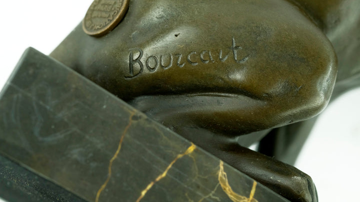 Bronze sculpture of a playing cat