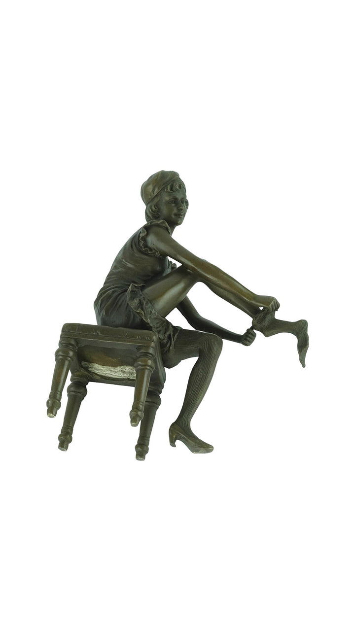 Bronze sculpture of a sitting female putting on stockings