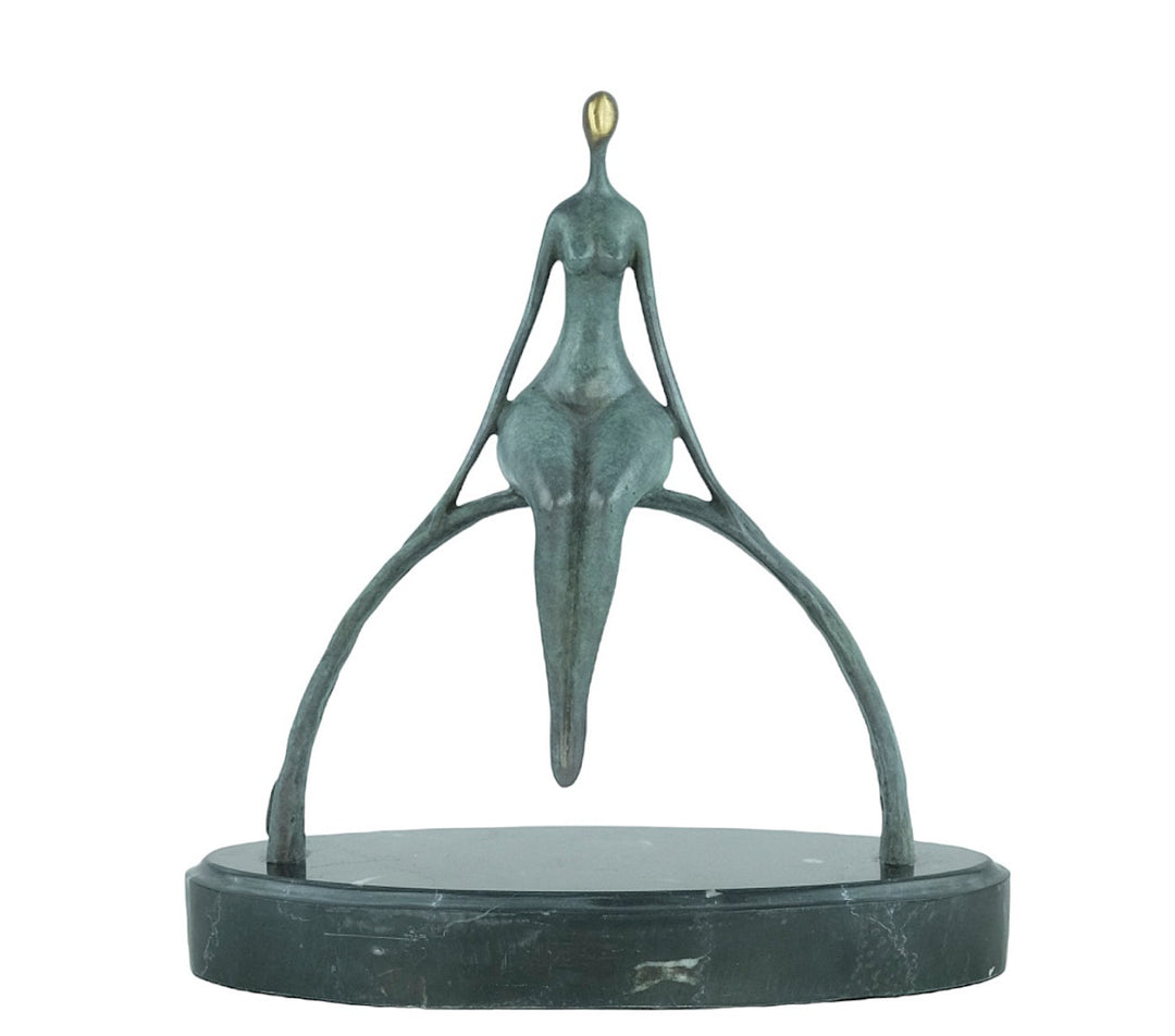 Modern bronze sculpture of a female sitting on a bow