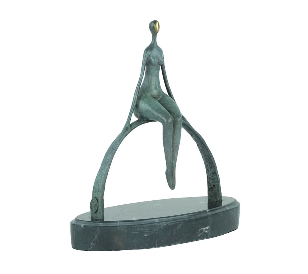 Modern bronze sculpture of a female sitting on a bow