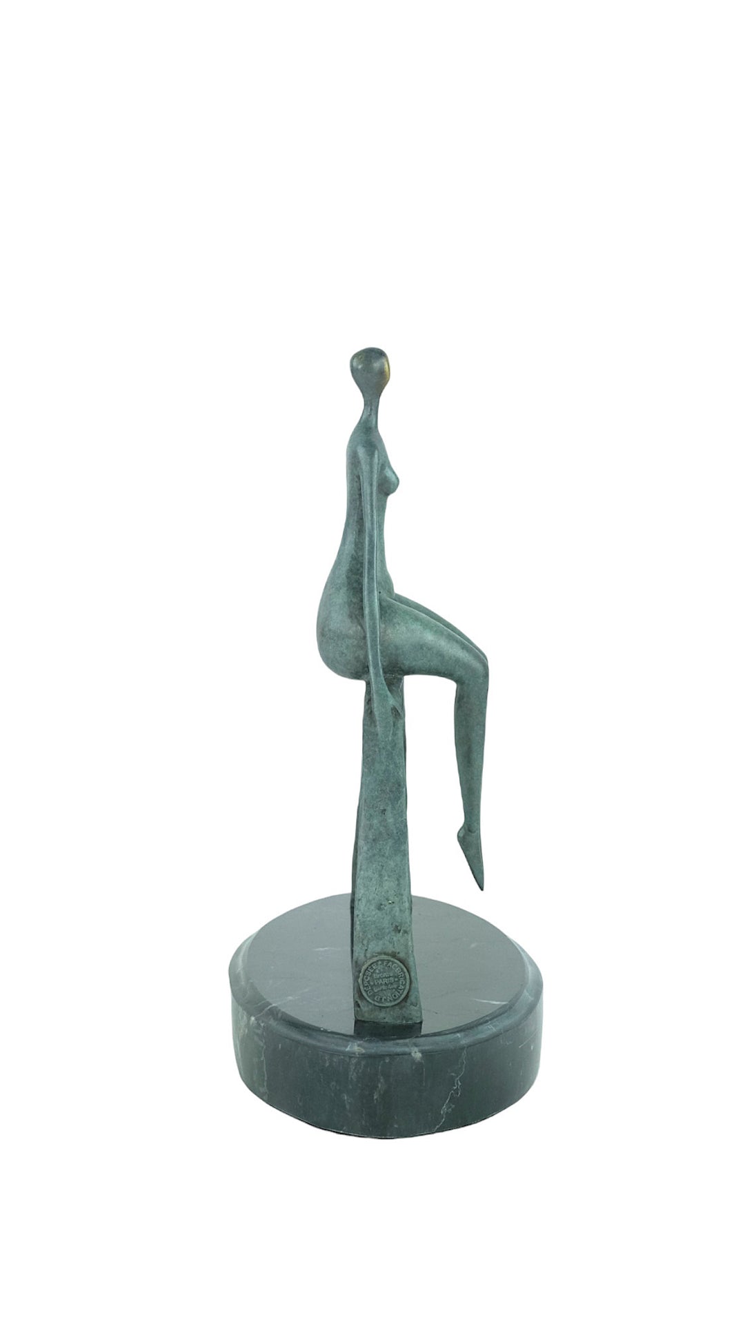 Modern bronze sculpture of a female sitting on a bow