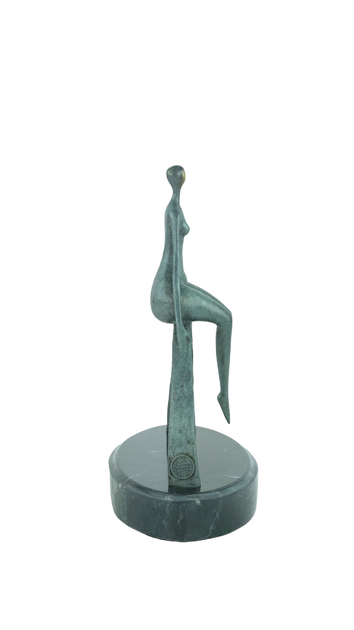 Modern bronze sculpture of a female sitting on a bow