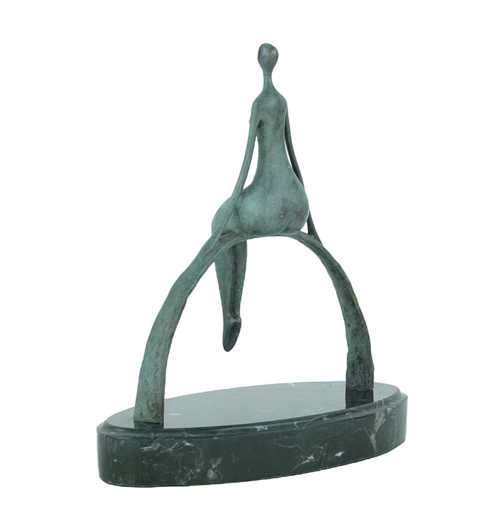 Modern bronze sculpture of a female sitting on a bow
