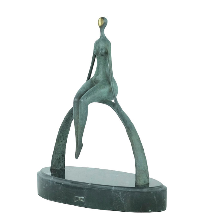 Modern bronze sculpture of a female sitting on a bow