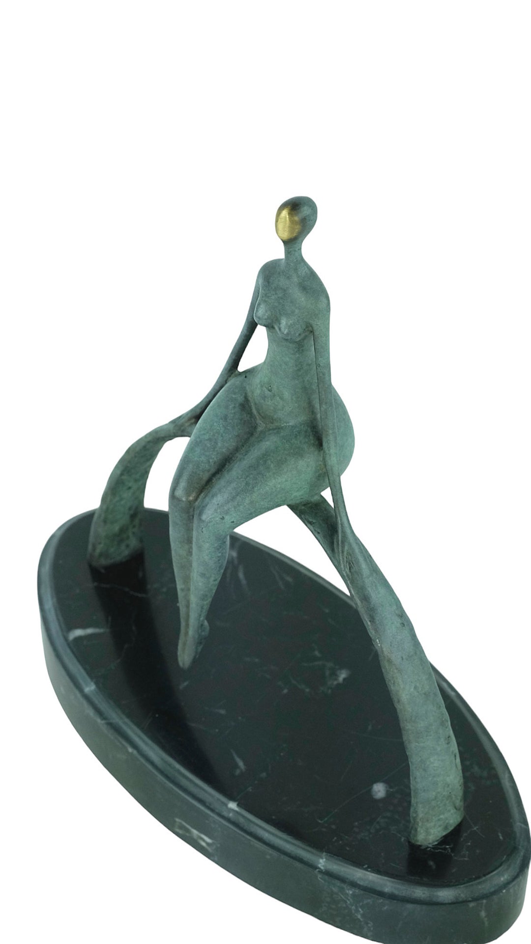 Modern bronze sculpture of a female sitting on a bow