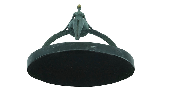 Modern bronze sculpture of a female sitting on a bow