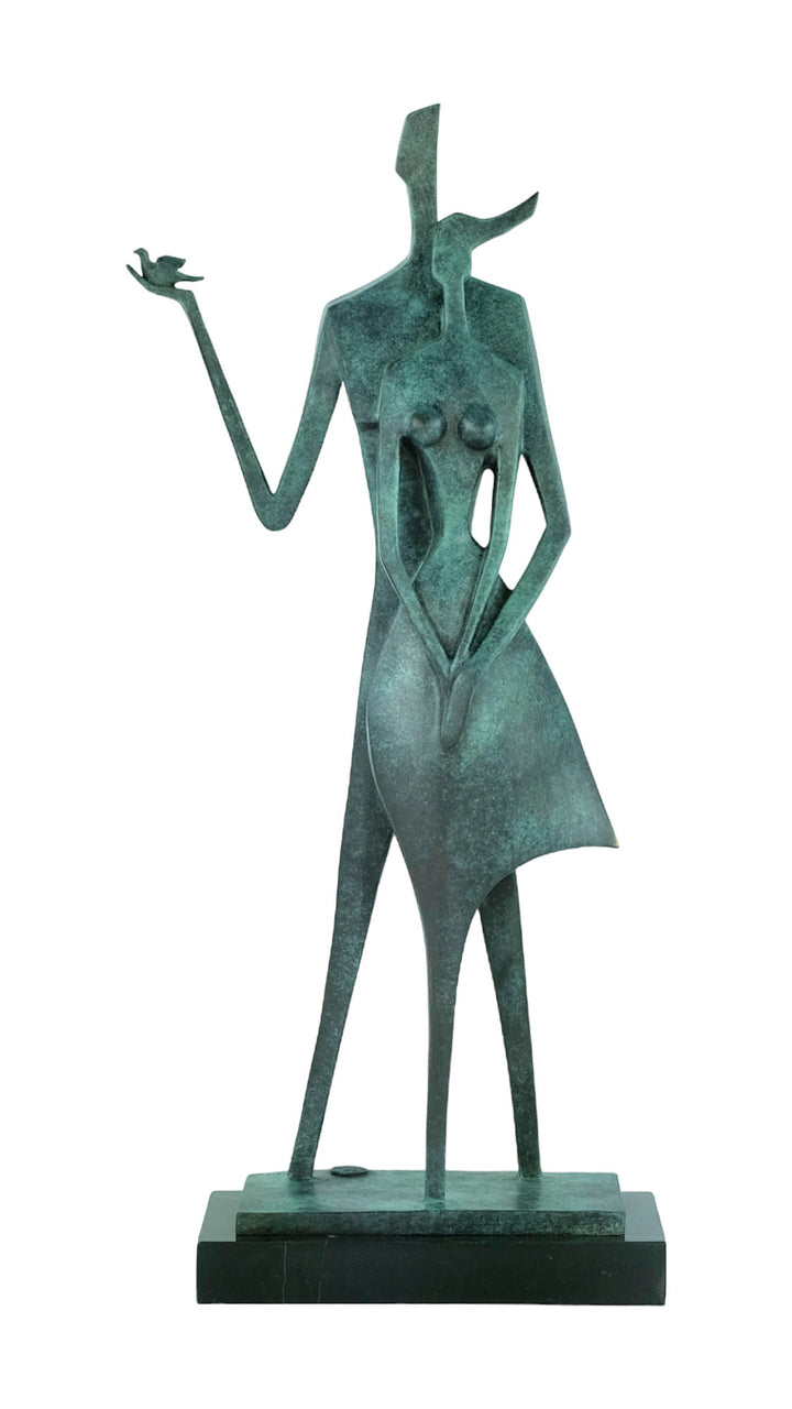 Modern bronze sculpture of a standing couple with a dove