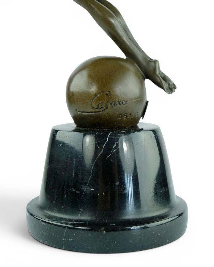 Bronze sculpture of a winged female in rising motion