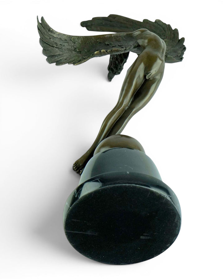 Bronze sculpture of a winged female in rising motion