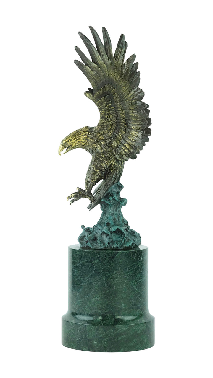 Large bronze sculpture of a fishing eagle with wings spread