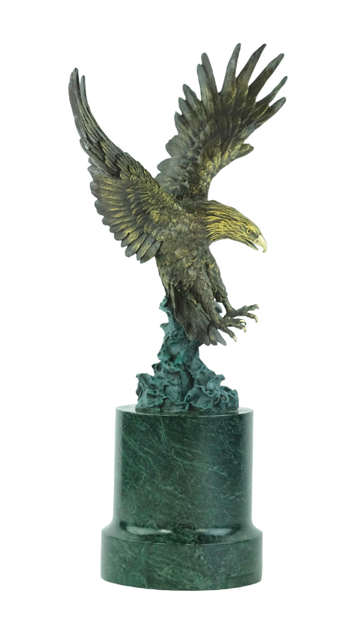 Large bronze sculpture of a fishing eagle with wings spread