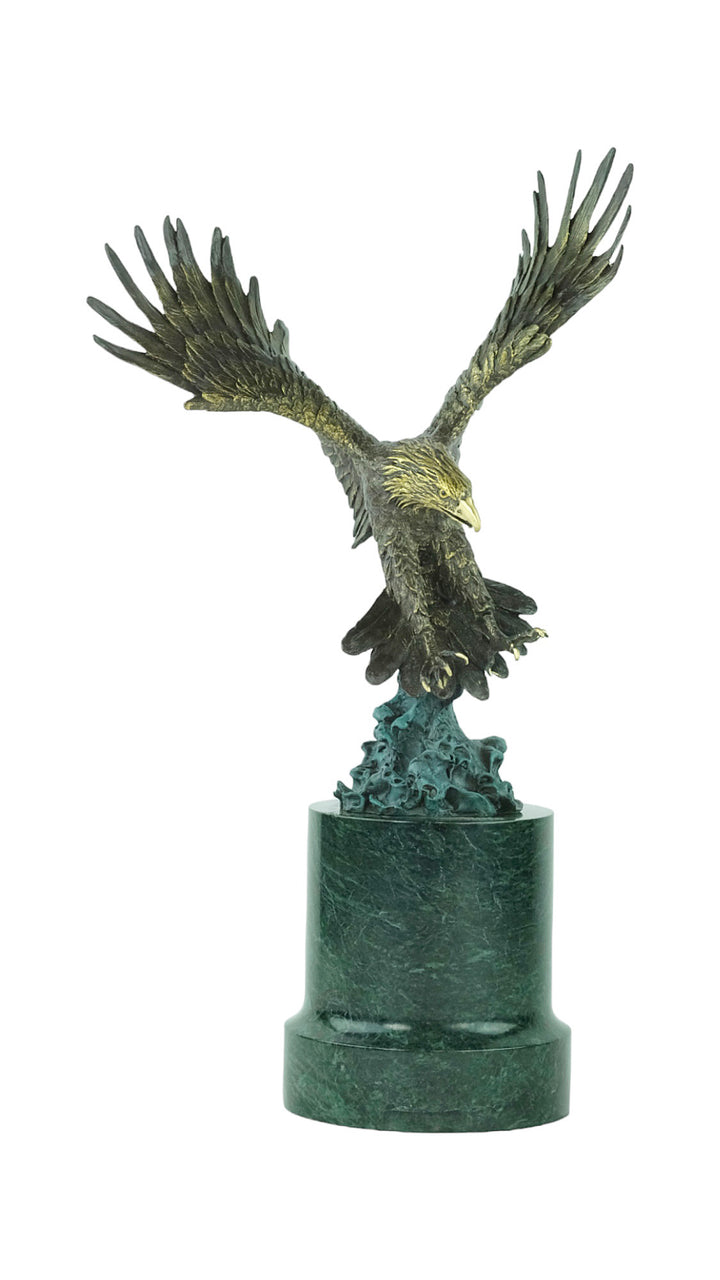 Large bronze sculpture of a fishing eagle with wings spread