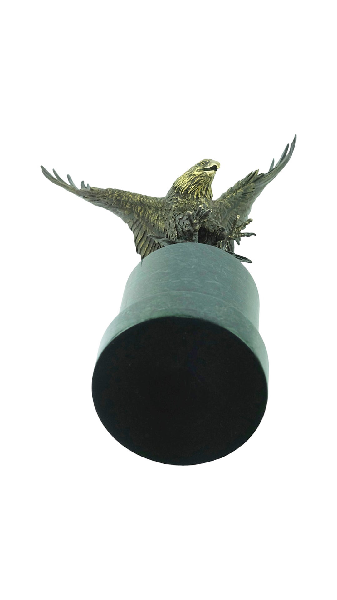 Large bronze sculpture of a fishing eagle with wings spread