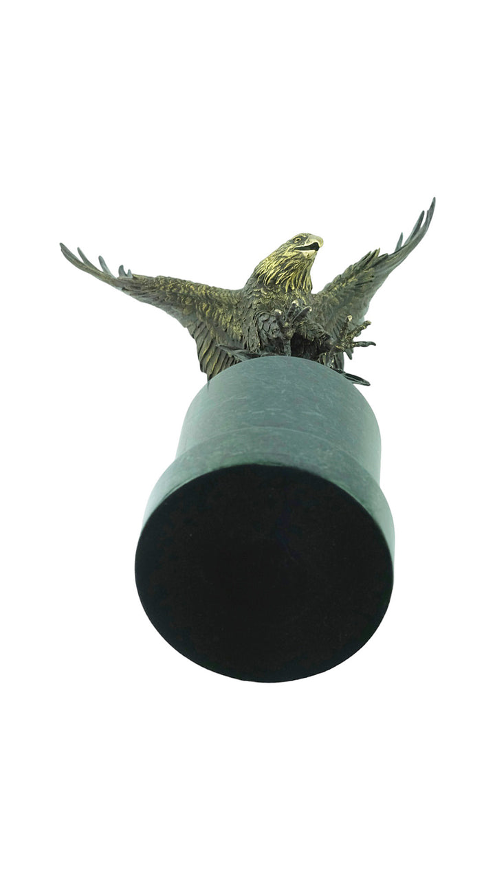 Large bronze sculpture of a fishing eagle with wings spread