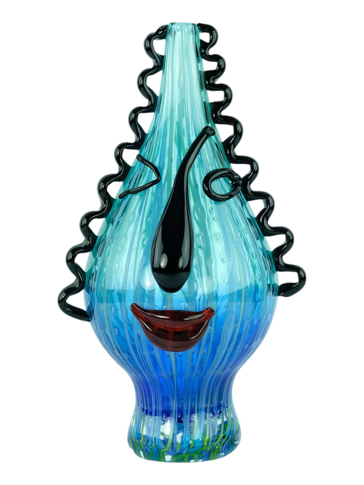 Glass vase of a winking female with curly hair - in Murano style