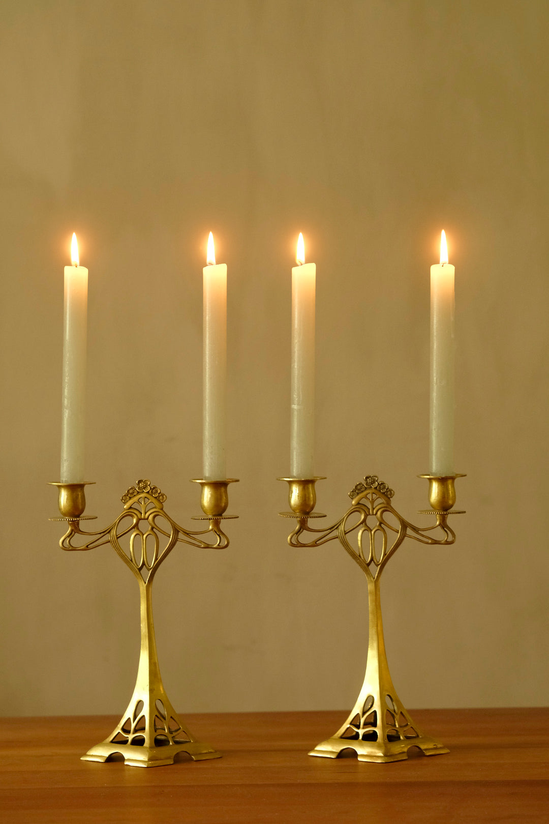 Set of two bronze candle holders in Jugendstil style
