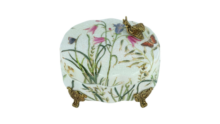 Porcelain box with floral decoration and a bronze snail