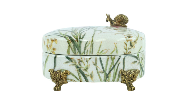 Porcelain box with floral decoration and a bronze snail