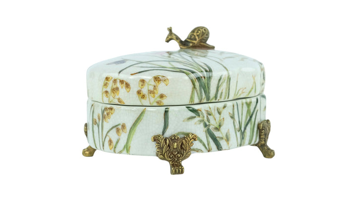 Porcelain box with floral decoration and a bronze snail
