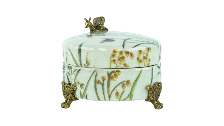 Porcelain box with floral decoration and a bronze snail