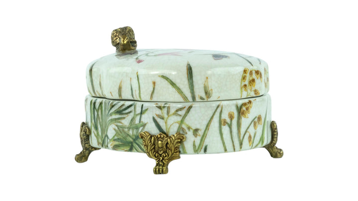 Porcelain box with floral decoration and a bronze snail