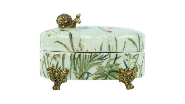 Porcelain box with floral decoration and a bronze snail