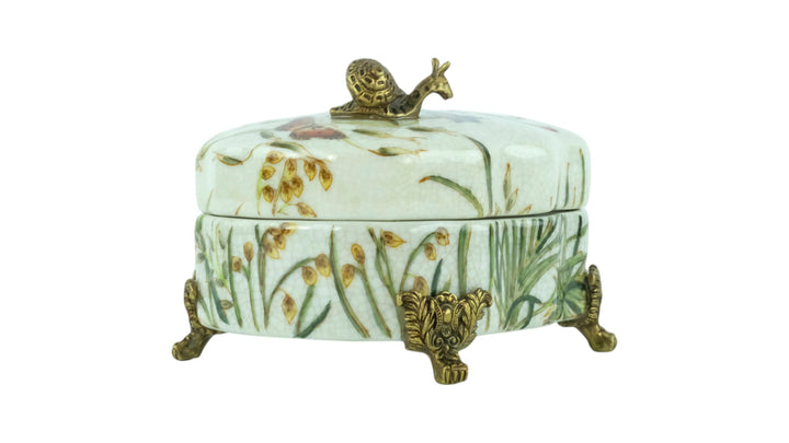 Porcelain box with floral decoration and a bronze snail