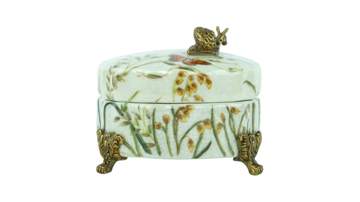 Porcelain box with floral decoration and a bronze snail
