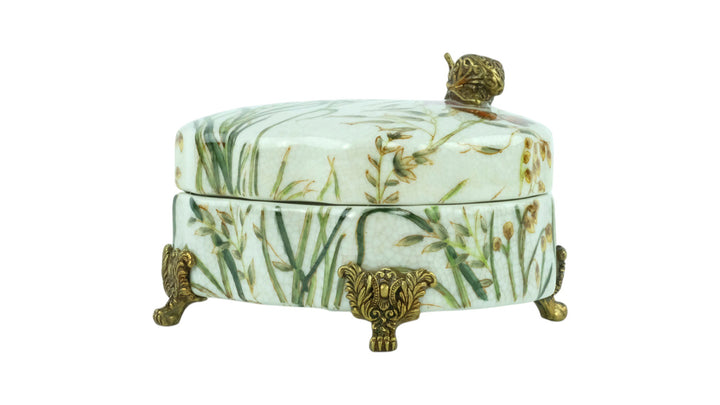 Porcelain box with floral decoration and a bronze snail