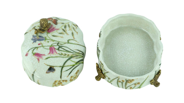 Porcelain box with floral decoration and a bronze snail