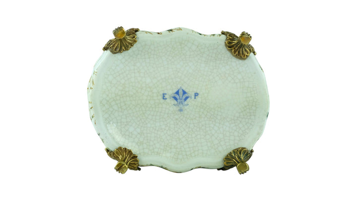 Porcelain box with floral decoration and a bronze snail