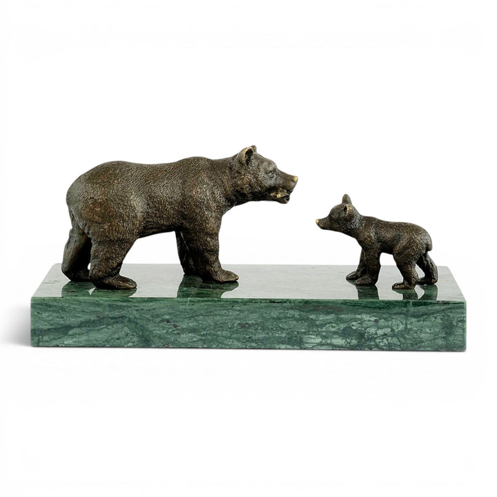 Bronze sculpture of a grizzly bear feeding her cub