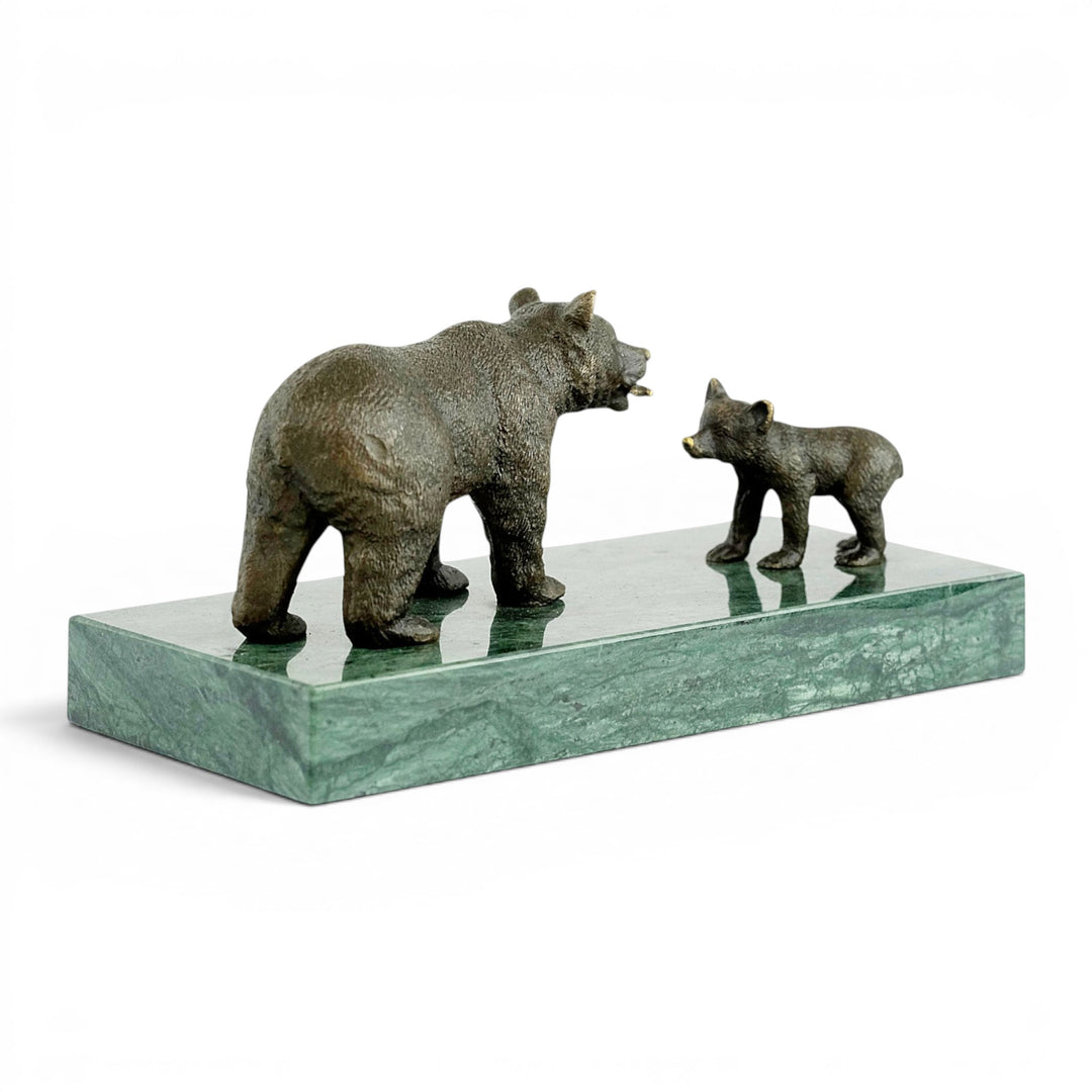 Bronze sculpture of a grizzly bear feeding her cub