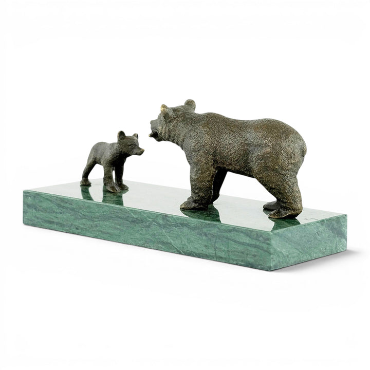 Bronze sculpture of a grizzly bear feeding her cub