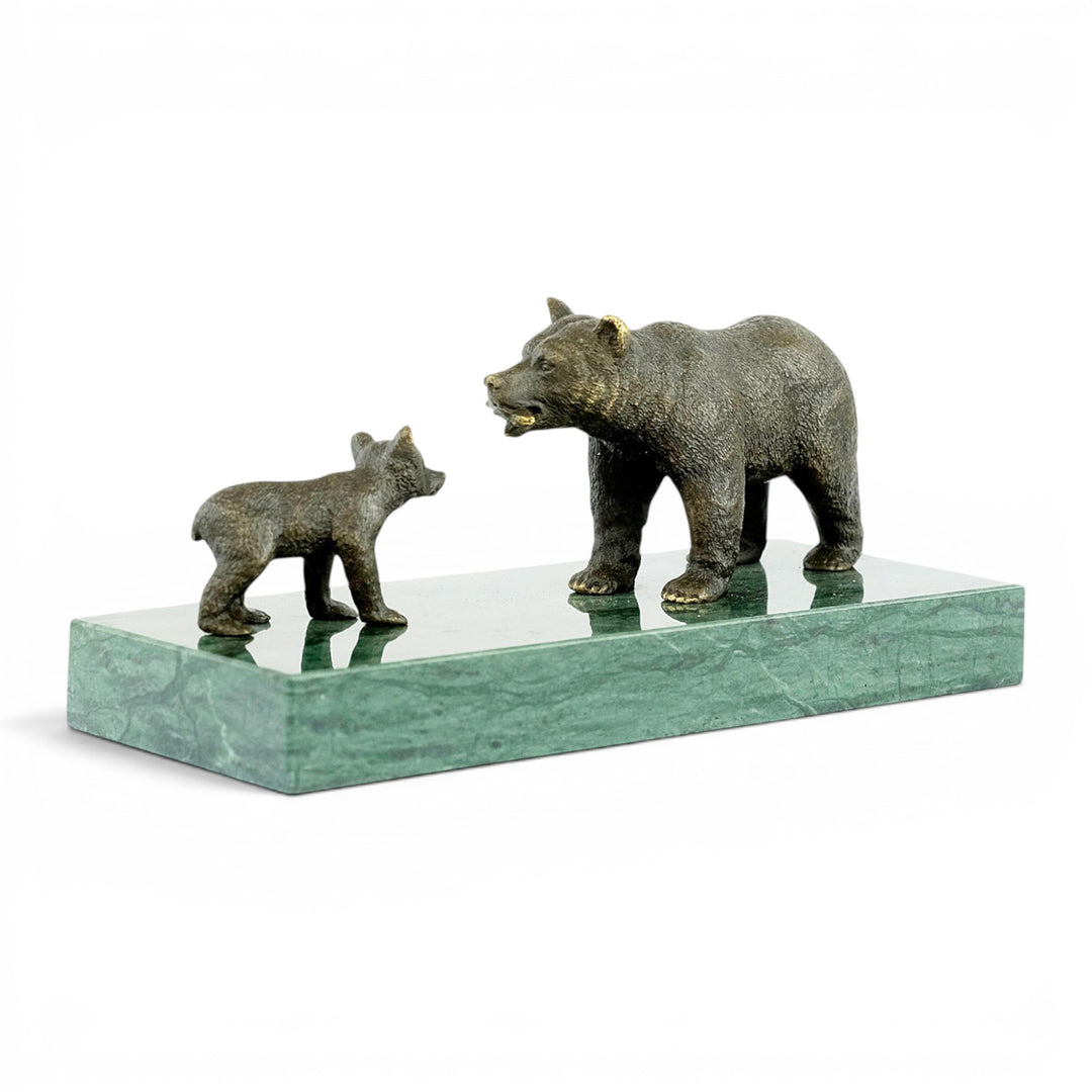 Bronze sculpture of a grizzly bear feeding her cub
