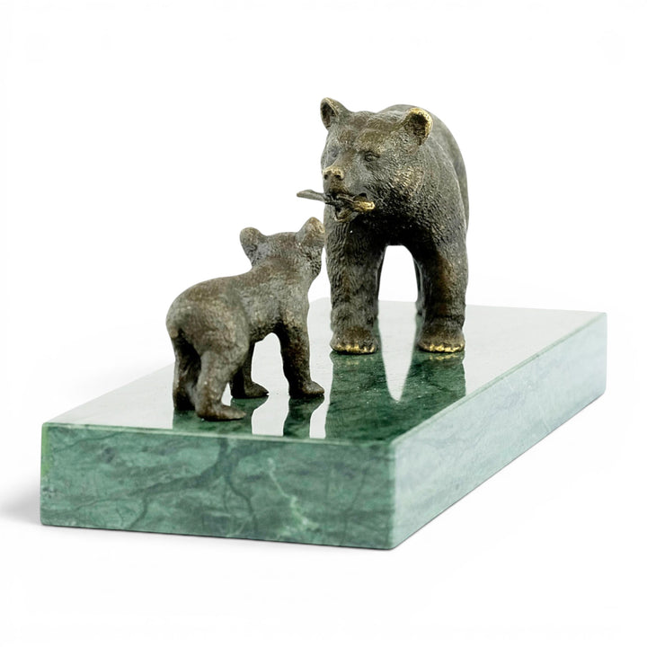 Bronze sculpture of a grizzly bear feeding her cub