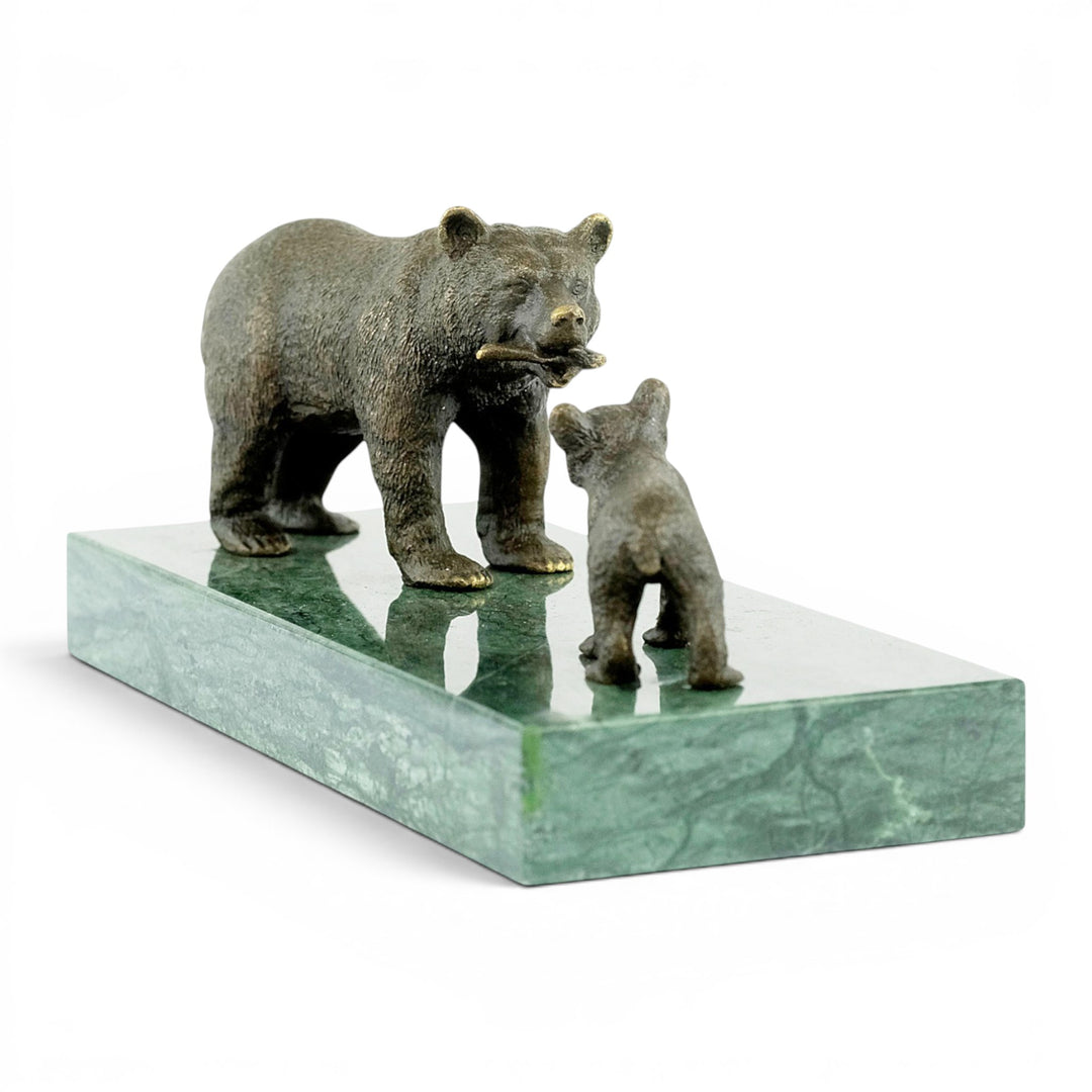Bronze sculpture of a grizzly bear feeding her cub