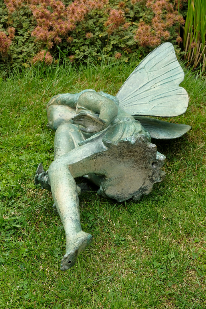Bronze sculpture of a winged fairy with a butterfly - green patina