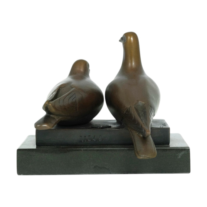 Bronze sculpture of a pigeon couple