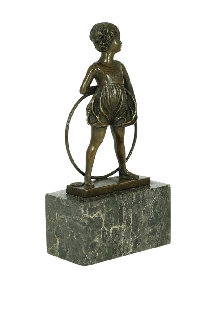 Bronze sculpture of a little girl with a hoop
