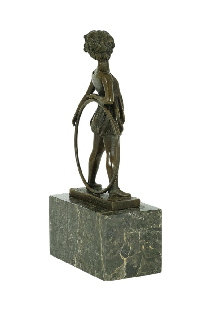 Bronze sculpture of a little girl with a hoop