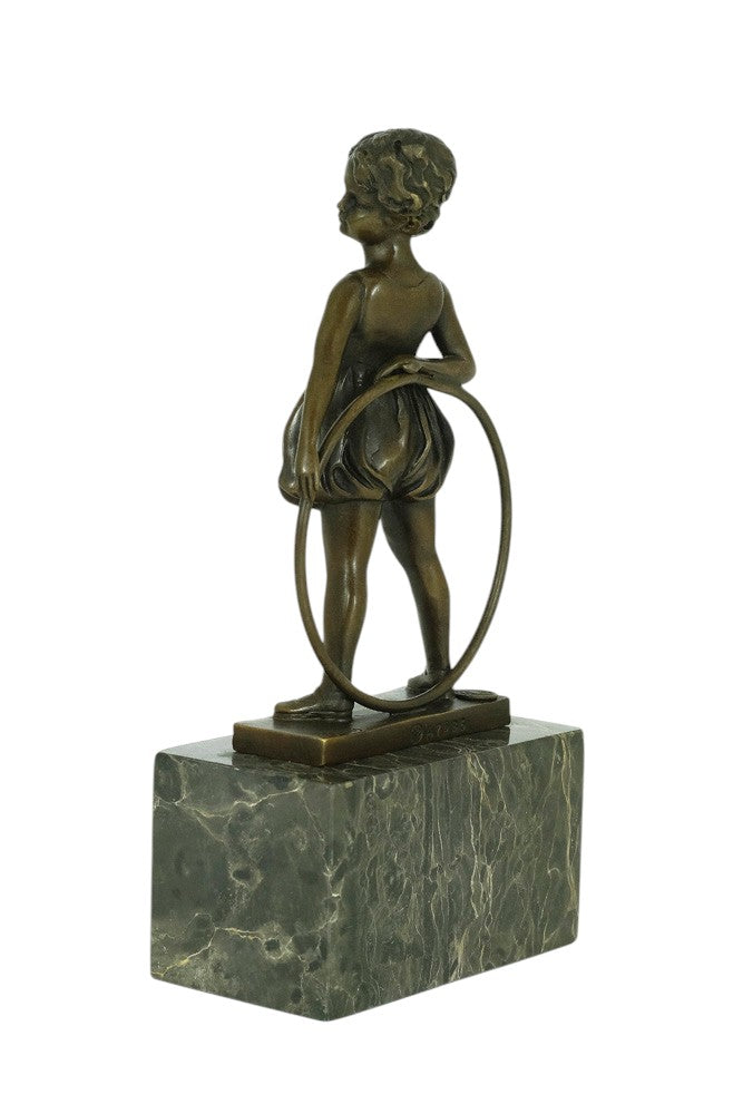 Bronze sculpture of a little girl with a hoop