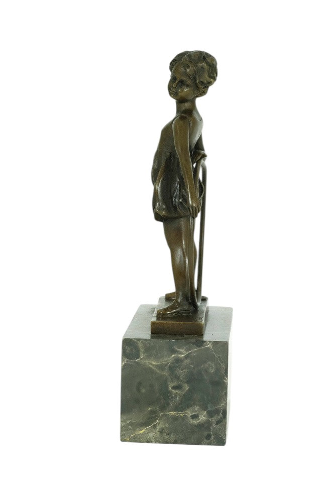 Bronze sculpture of a little girl with a hoop