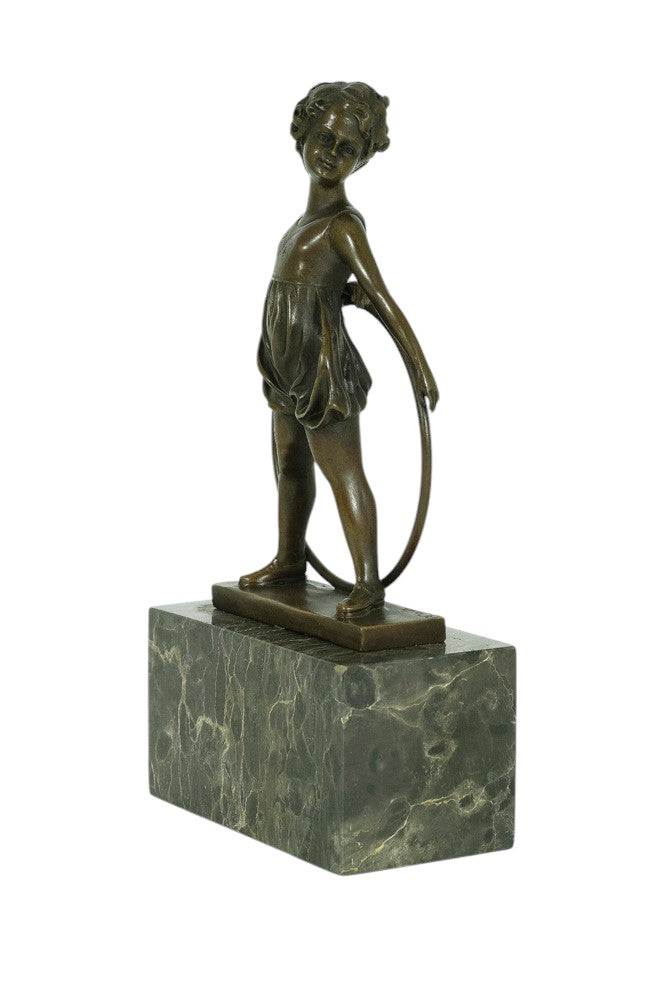 Bronze sculpture of a little girl with a hoop