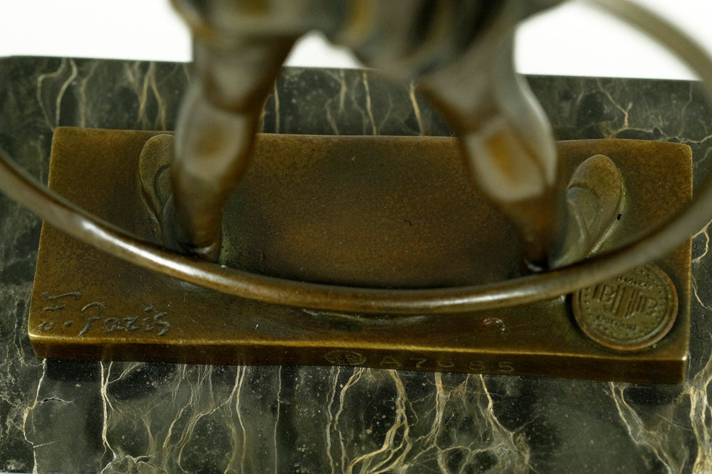 Bronze sculpture of a little girl with a hoop