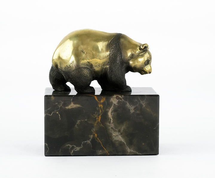 Bronze sculpture of a walking panda bear