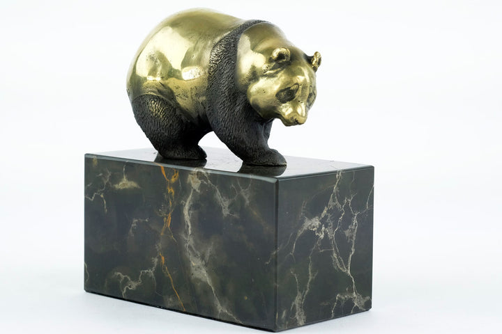 Bronze sculpture of a walking panda bear
