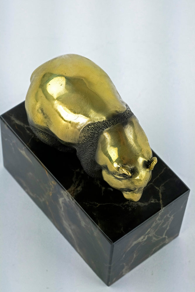 Bronze sculpture of a walking panda bear